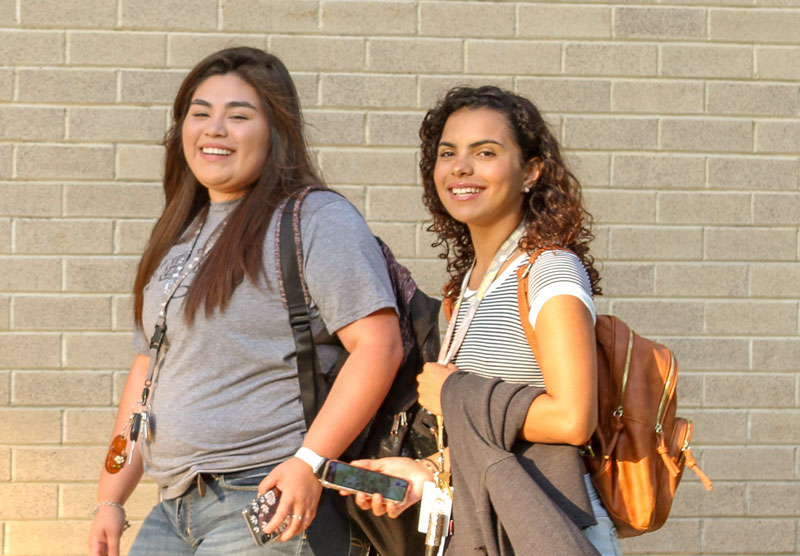 two female students walking on campus