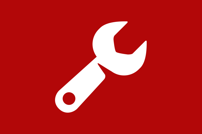 White wrench icon on a red background