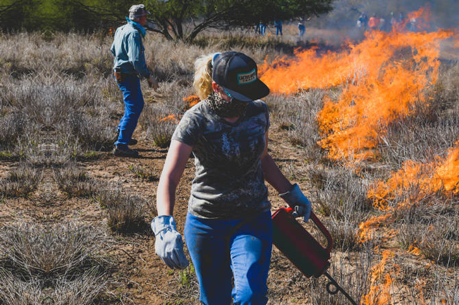Students participate in building a prescribed burn plan.